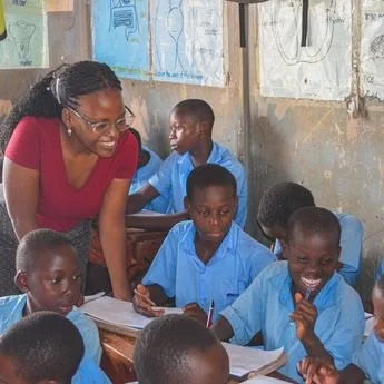 Teacher assisting student