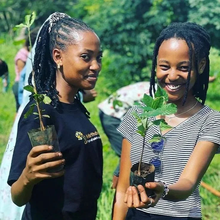 Two women with tree seedlings