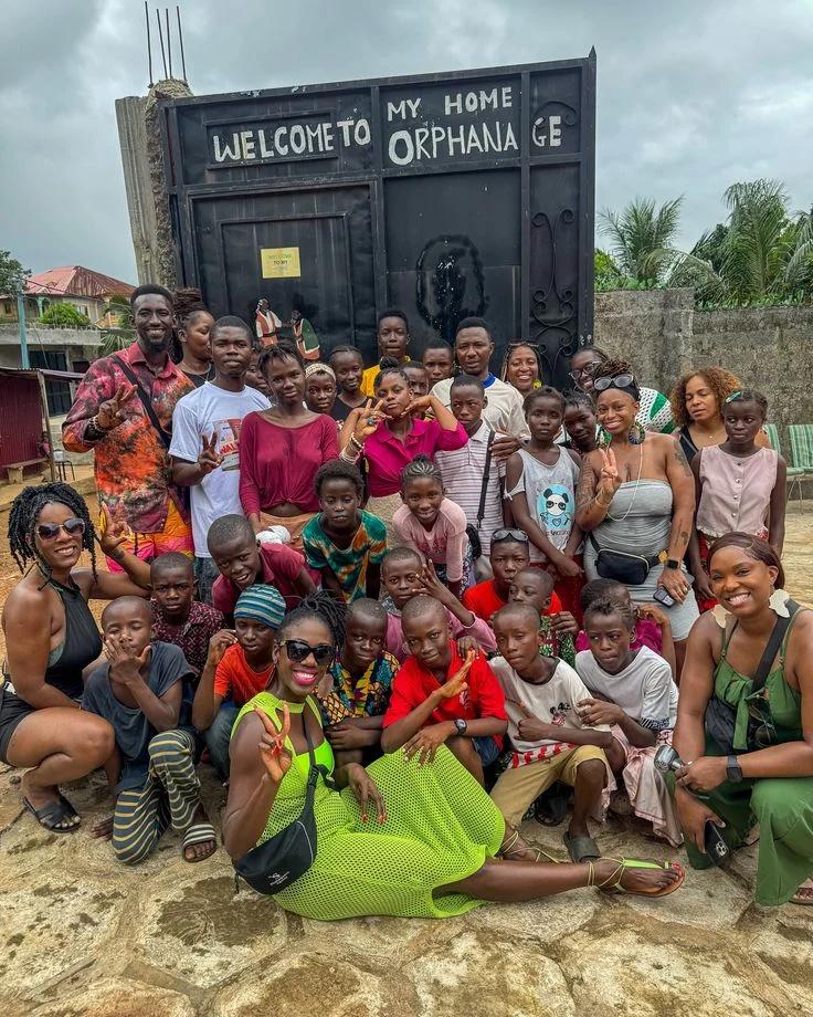 Large group of women and children outdoors